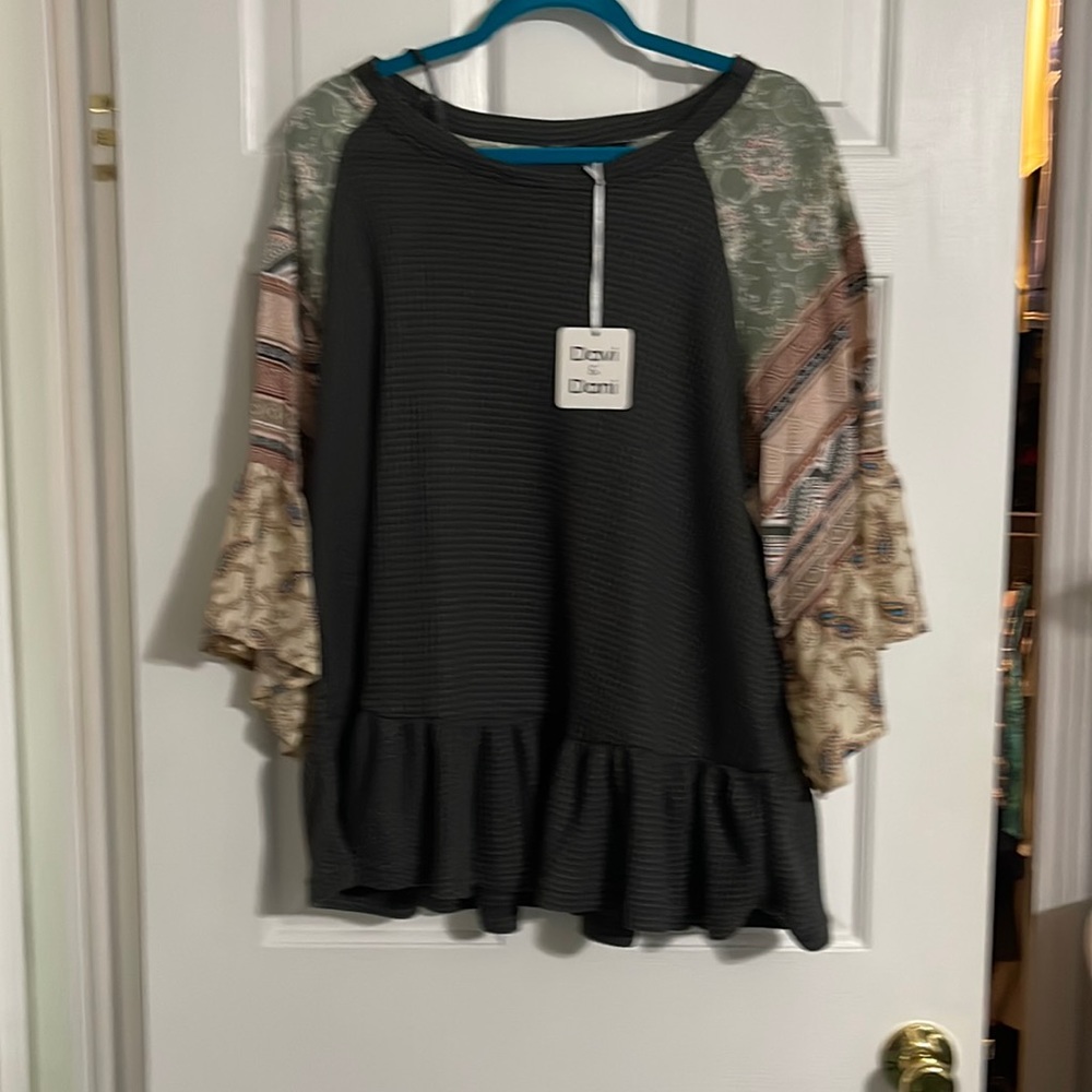 NWOT waffle knit peplum style ruffled sleeve and bottom, removed tag never worn